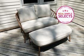 Better Homes & Gardens Willow Sage All-Weather Wicker Outdoor Loveseat & Ottoman Set on a patio