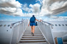 Person walking onto a plane