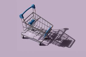 blue shopping cart on purple