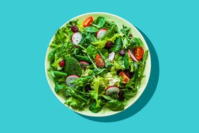 Healthy eating and exercising concepts: Top view of a fresh organic salad plat