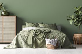 green bedroom with no side tables