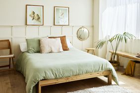 Pillows on empty bed. Interior of bedroom with decor. Furniture is at home.