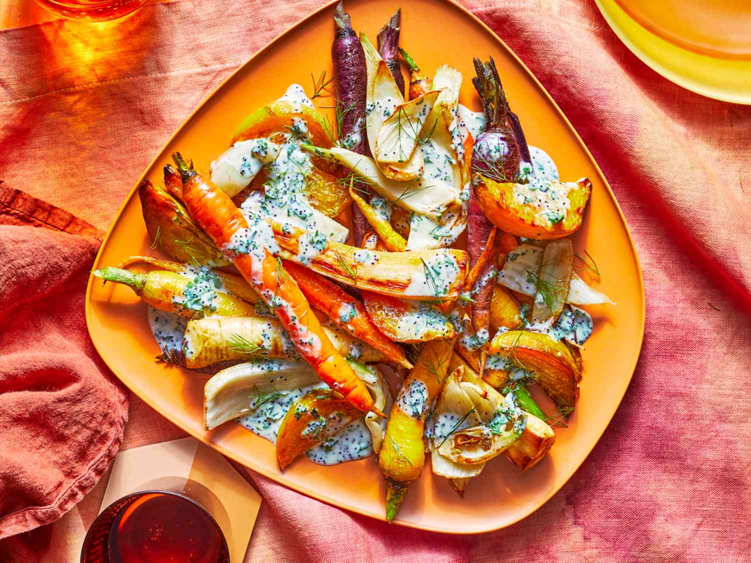 Caramelized Veggies With Poppy Seed Dressing on a pink linen