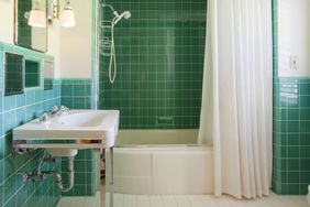 Colorful designer bathroom with shower curtain.