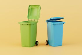 Plastic garbage containers isolated on yellow background