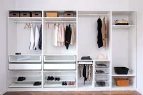 Organized closet with clothes, shoes, and baskets