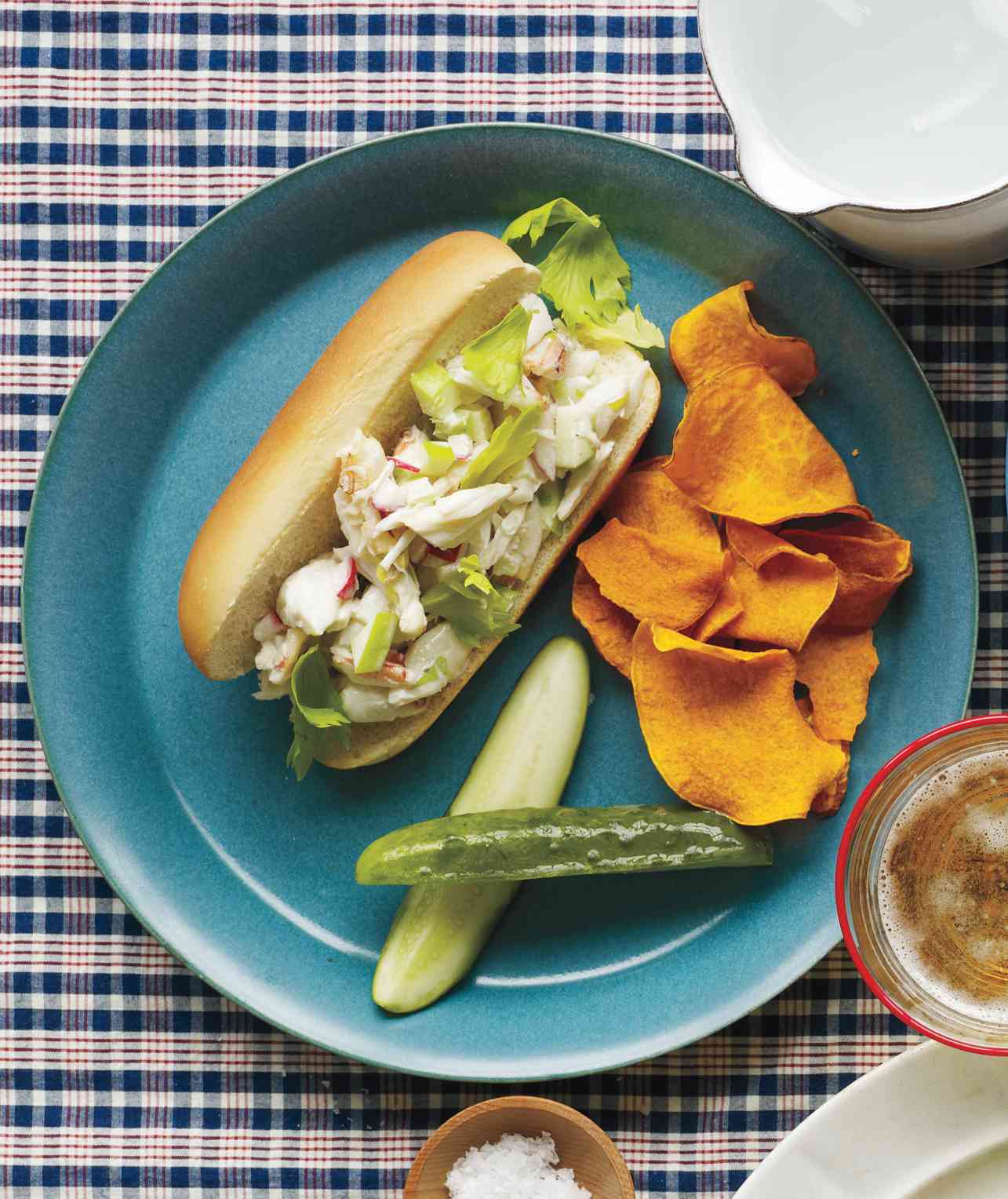 Overhead View of a Crab Roll Served With Chips and Dill Spears