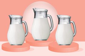 three pitchers filled with heavy cream