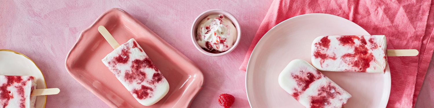 Desserts: Sweet pink popsicles with raspberries