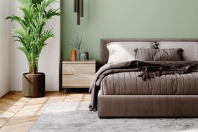 Interior of a modern bedroom decorated with modern furniture with pastel tones.