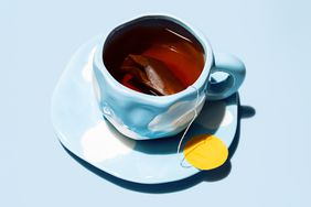 Tea cup with teabag. Teatime creative concepts.