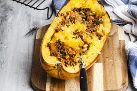 Baked spaghetti squash with vegan bolognese sauce made from lentils, leeks, and carrots