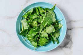 top view of kale leaves in a blue bowl