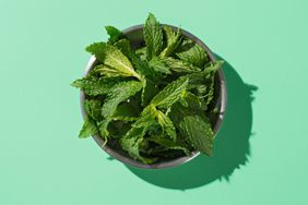 A bowl of fresh mint on a table