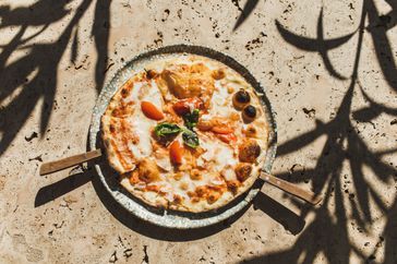 Italian traditional meal. Comfort, tasty and fast food. Unhealthy eating. Background with beautiful daylight and shadows