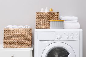 laundry room with baskets and folded towels