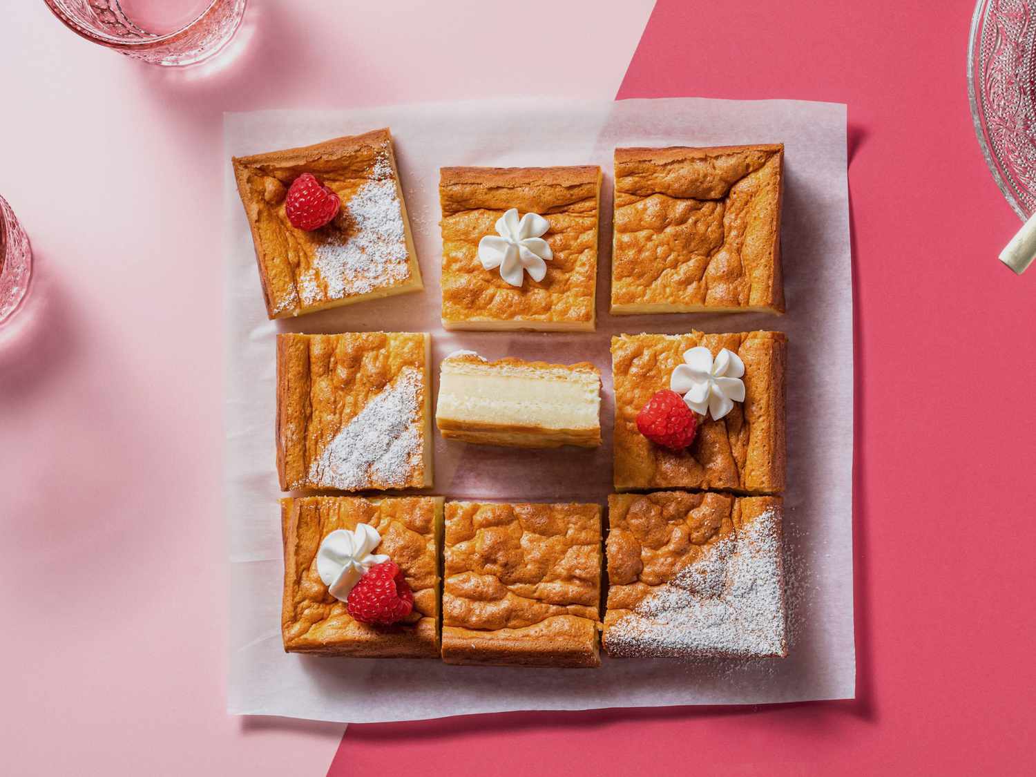 overhead view of multiple pieces of cake on parchment paper