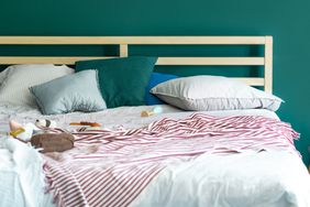 Baby's playground: parents' bed with toys on it.