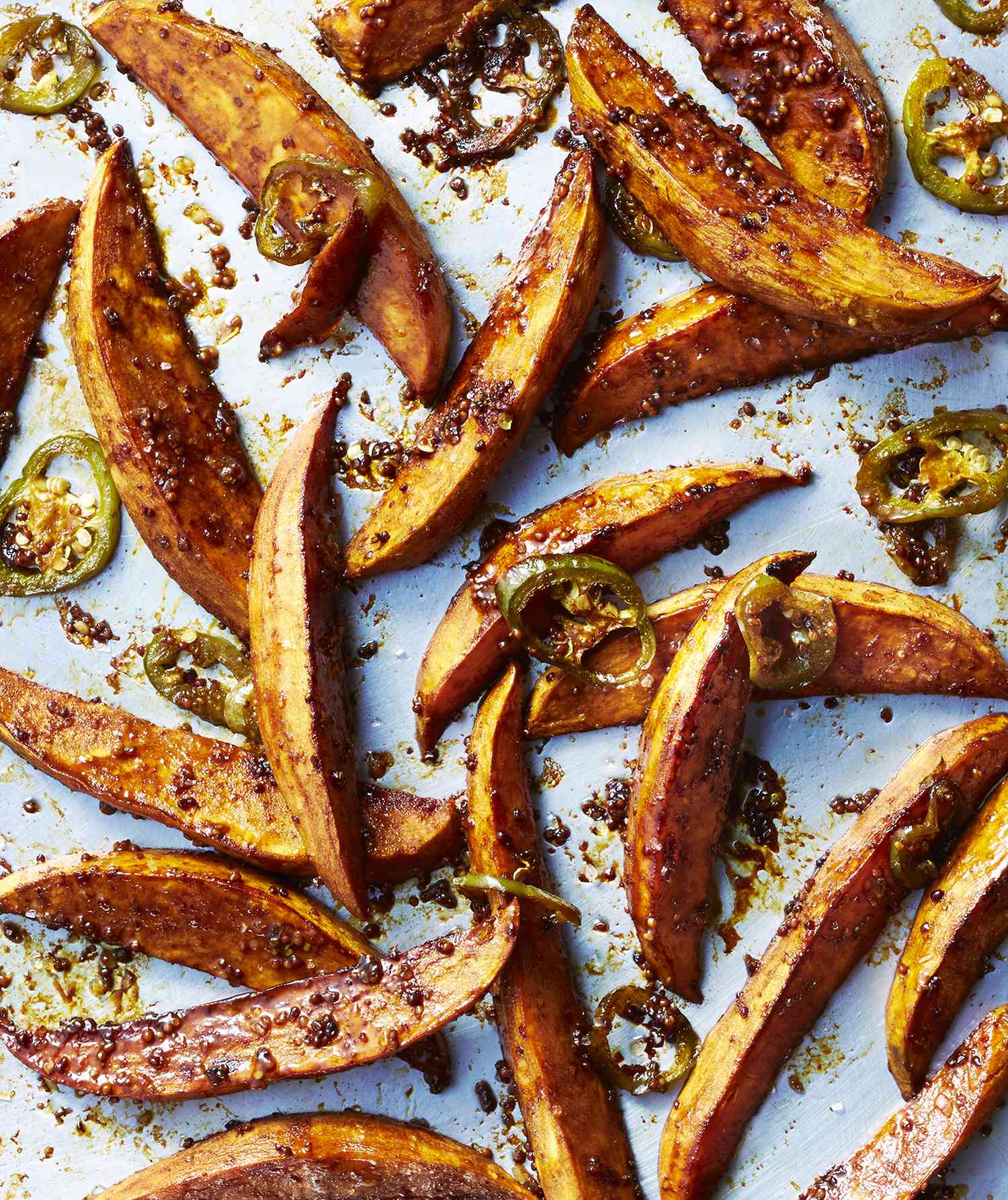 Molasses and Chile Roasted Sweet Potato Wedges on a Baking Sheet