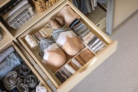 organize-clothes-in-drawer-GettyImages-1694789594