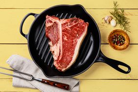 A steak cooking in a pan