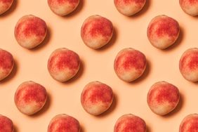 pattern of peaches on a pastel background. Flat lay, top view.