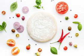 instant pot pizza dough, surrounded by vegetables