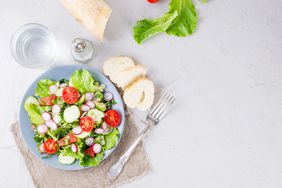 Lunch salad on a plate with bread