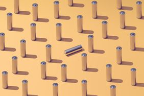 A pattern of batteries laid out on a colorful background symbolizing, standing out from the crowd