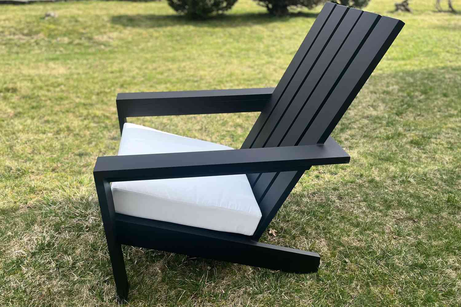 The side of the Pottery Barn Malibu Metal Adirondack Outdoor Lounge Chair