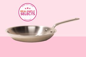 One of the best Stainless Steel Skillets on a two-toned pink background. 