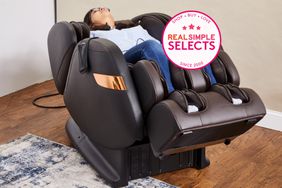 person laying back in massage chair