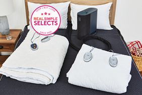 Heated mattress pads displayed on a bed 