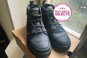 Real Simple Selects badge image of Dr. Martens boots on box next to window