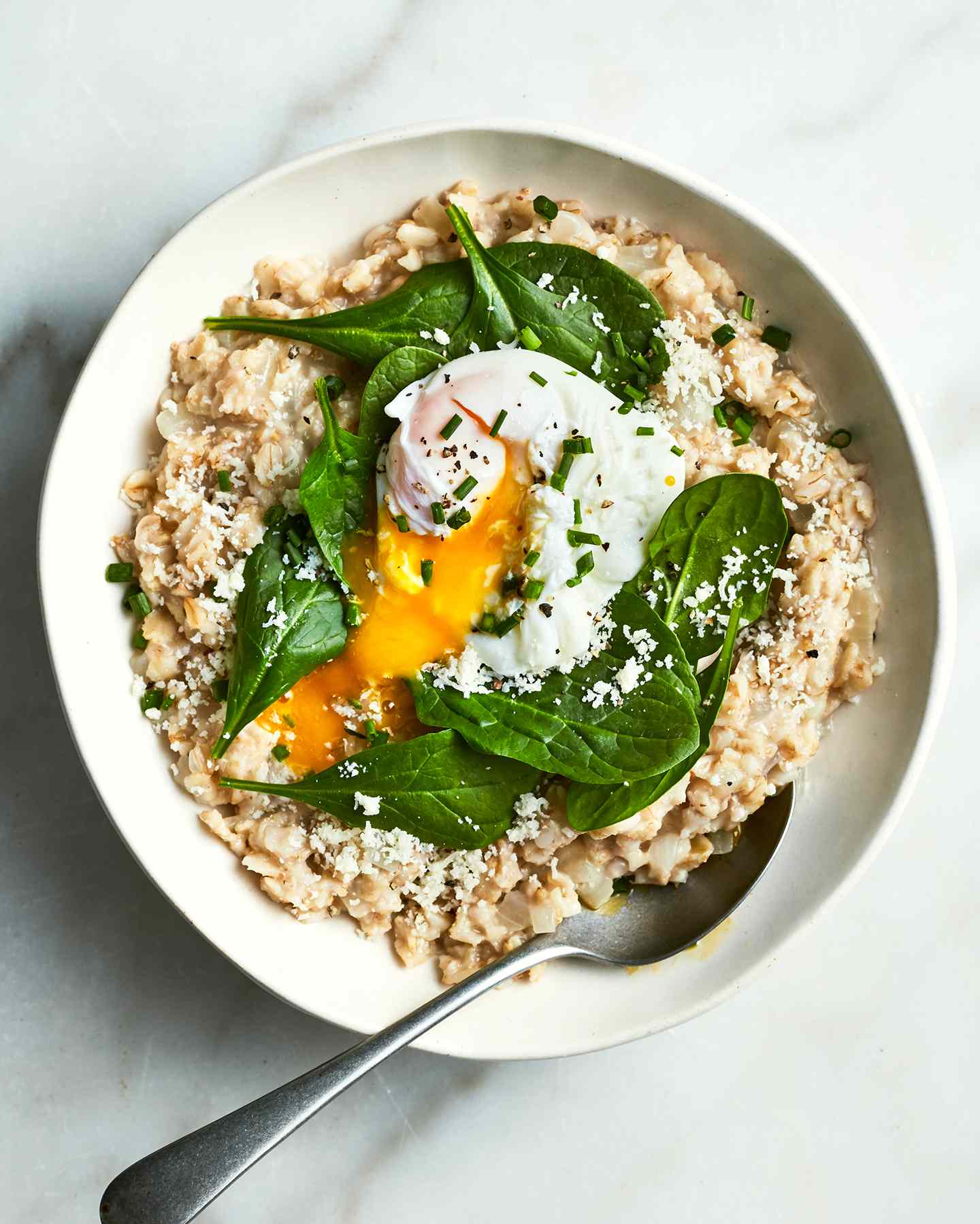 A savory oatmeal with egg and spinach is the breakfast you didnât know you needed in your life. Get the recipe for Savory Oatmeal With Spinach and Poached Eggs.