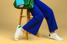 woman with flare pants and sneakers