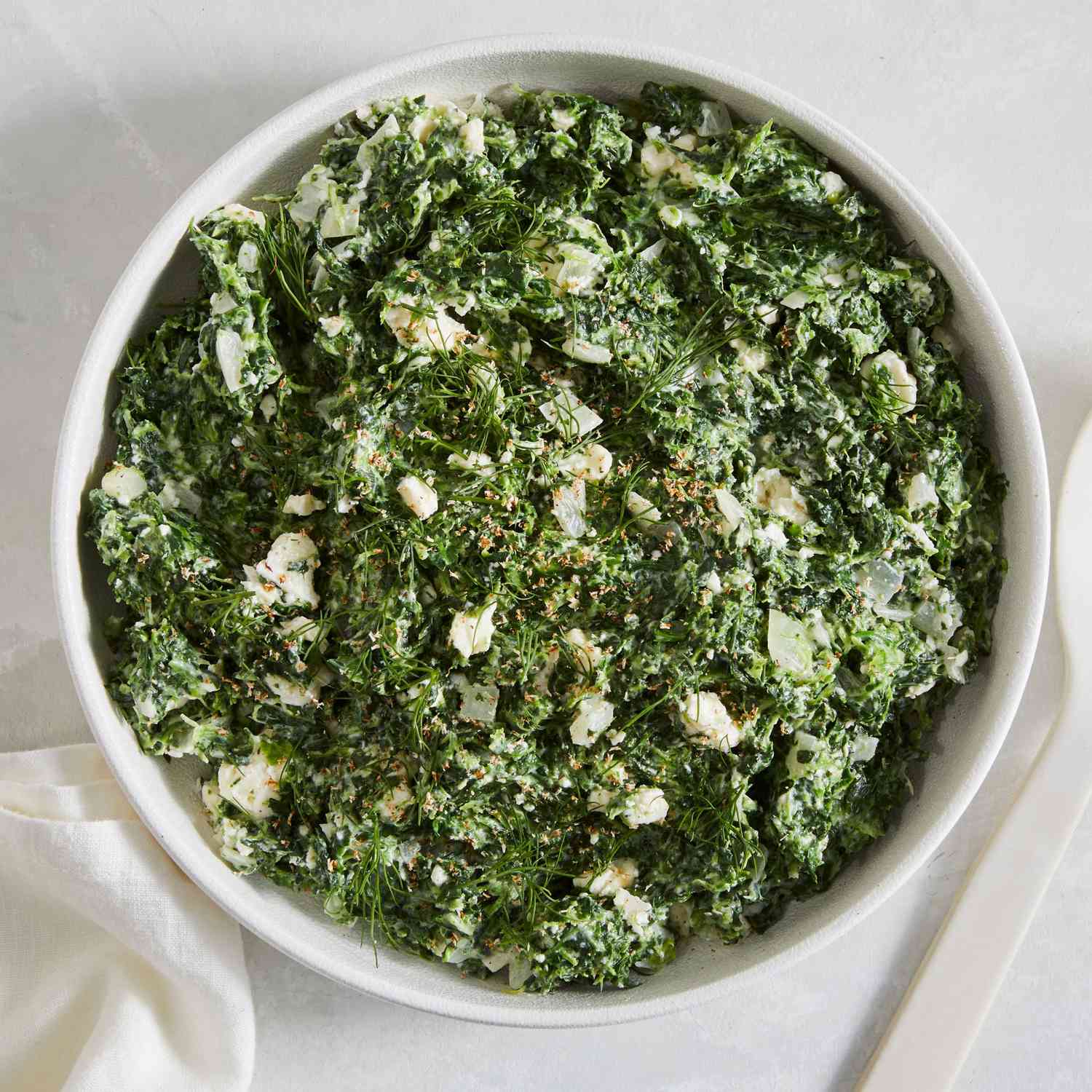 Spanakopita Creamed Spinach in a white bowl