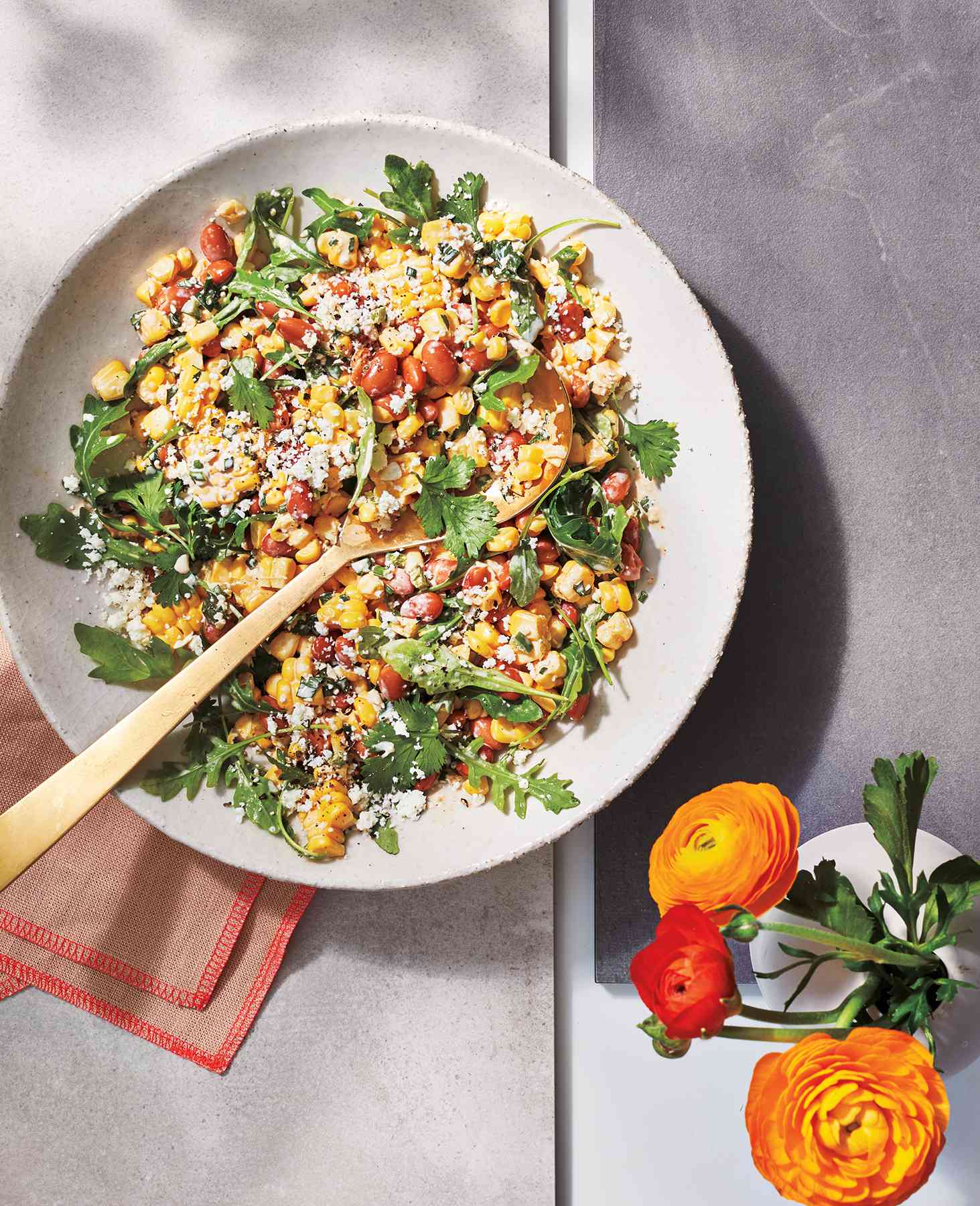 Spicy Street Corn Salad in a serving dish with a spoon.