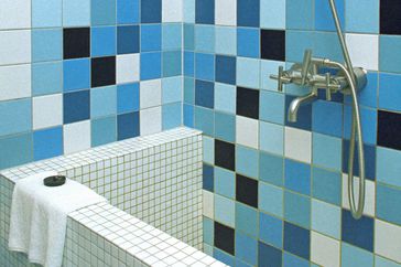 Block tiled bath and Shower stall.