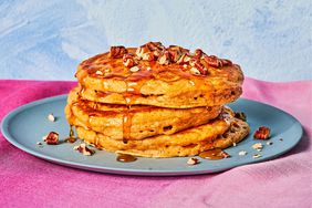 Stack of Three Sweet Potato Buttermilk Pancakes Topped With Syrup and Nuts