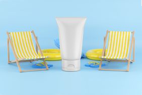 Travel bottle of toiletries with beach chairs 