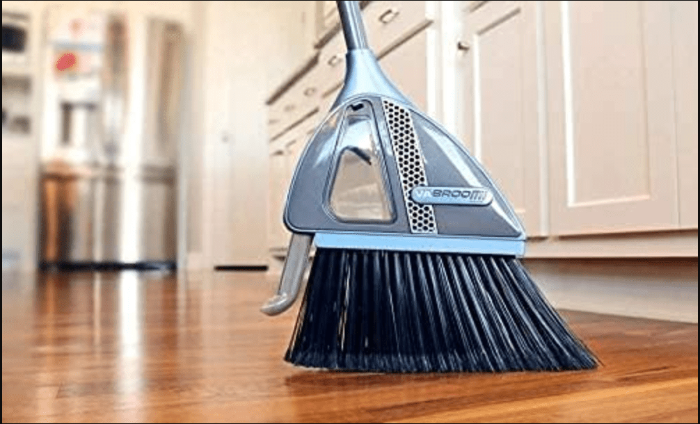 a broom with an attached little vacuum